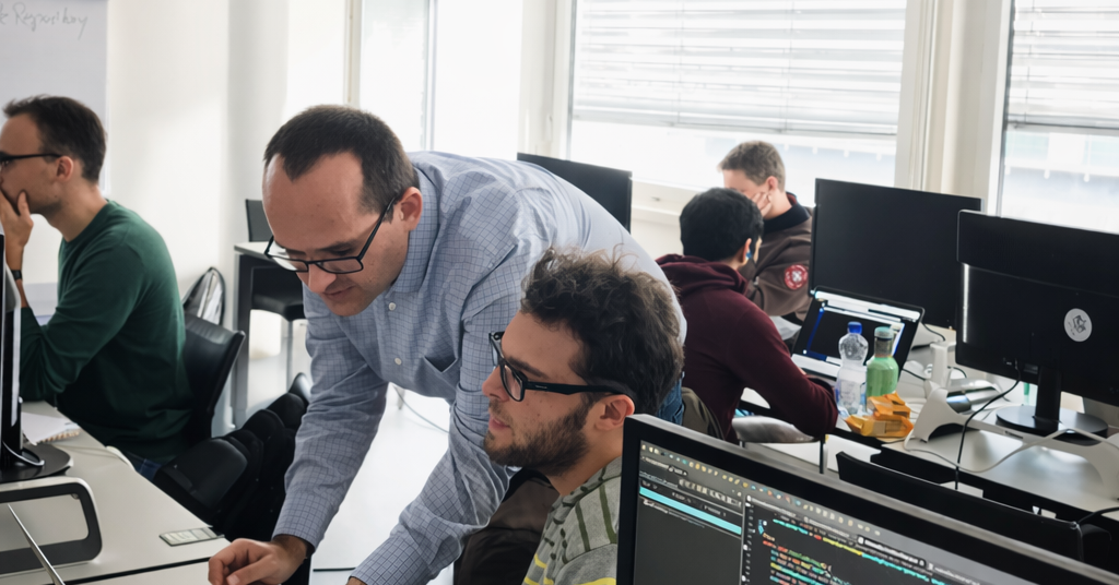 Engineering team working on software and IT systems in the Thonex office, Switzerland
